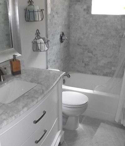 Custom tiled bath with vanity and tub-shower combination