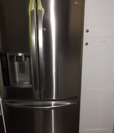 Stainless steel fridge with ice-maker and water dispenser