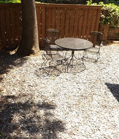 Private enclosed patio with stone