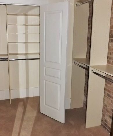 master bedroom two person walk in closet with custom built ins and abundance of storage
