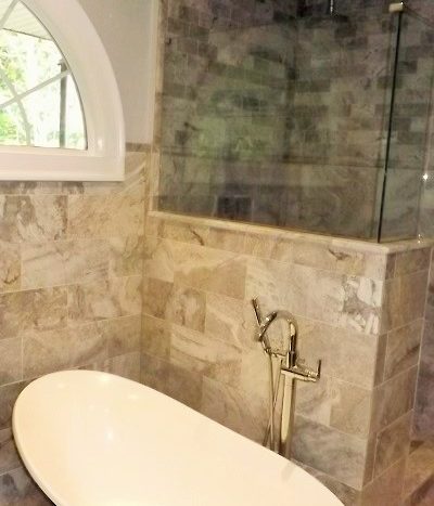 master bath soaking tup and glass shower with custom tile